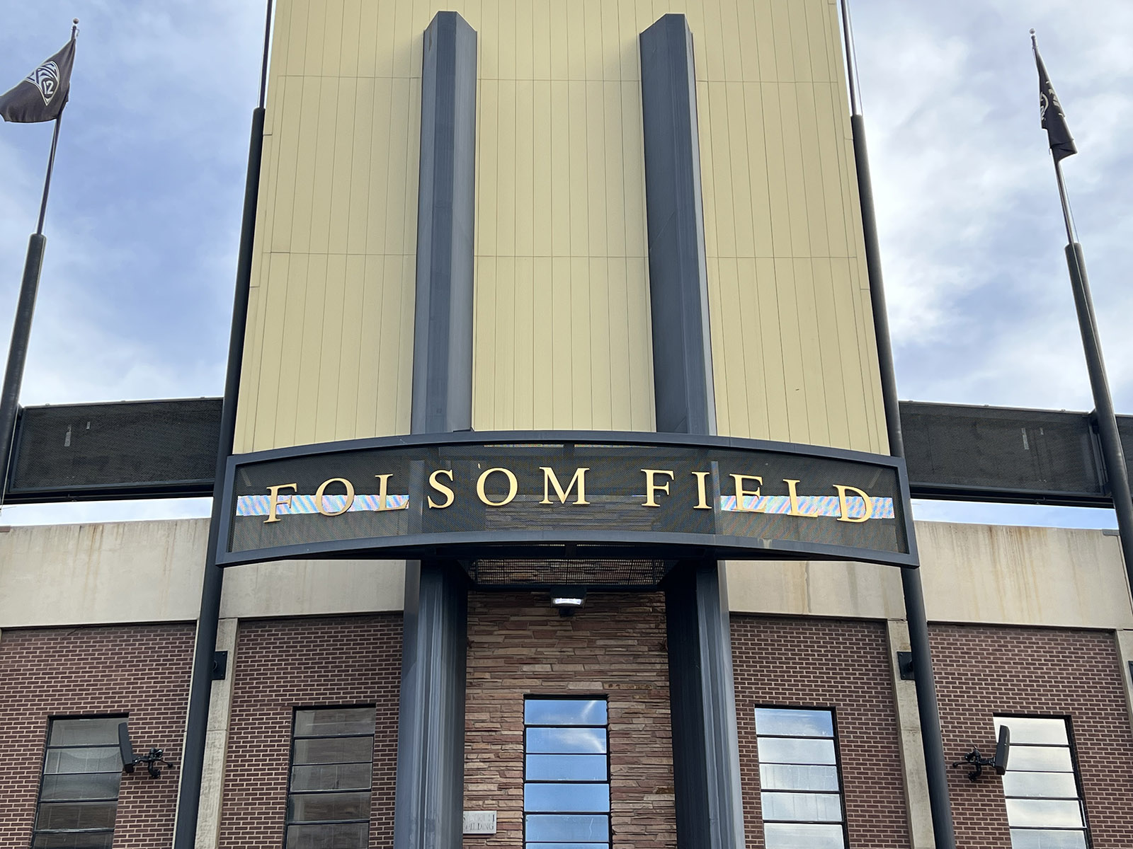 Exterior signage above an entrance to Folsom Field in Boulder, Colorado
