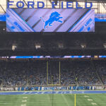 View of the field and seating bowl at Ford Field in Detroit, Michigan, during a Lions football game