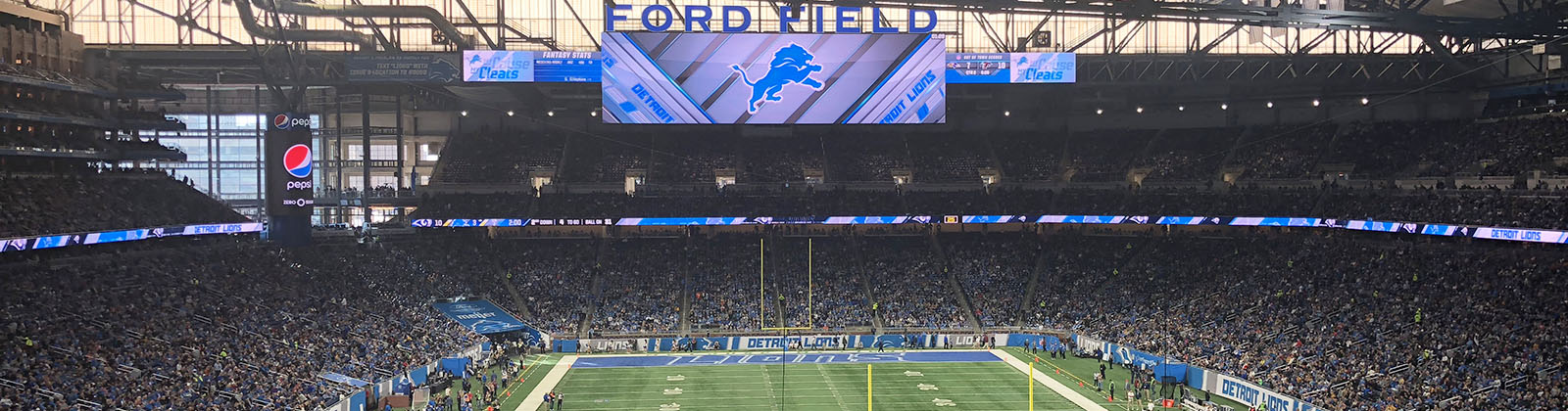 View of the field and seating bowl at Ford Field in Detroit, Michigan, during a Lions football game