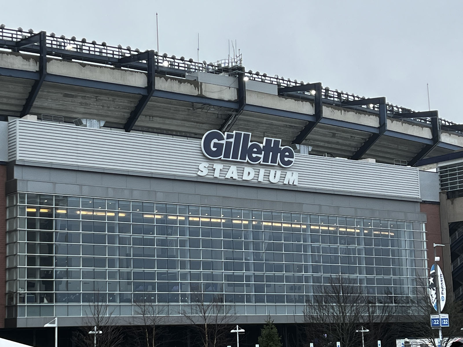 Exterior signage on the façade of Gillette Stadium, a football venue in Foxborough, Massachusetts