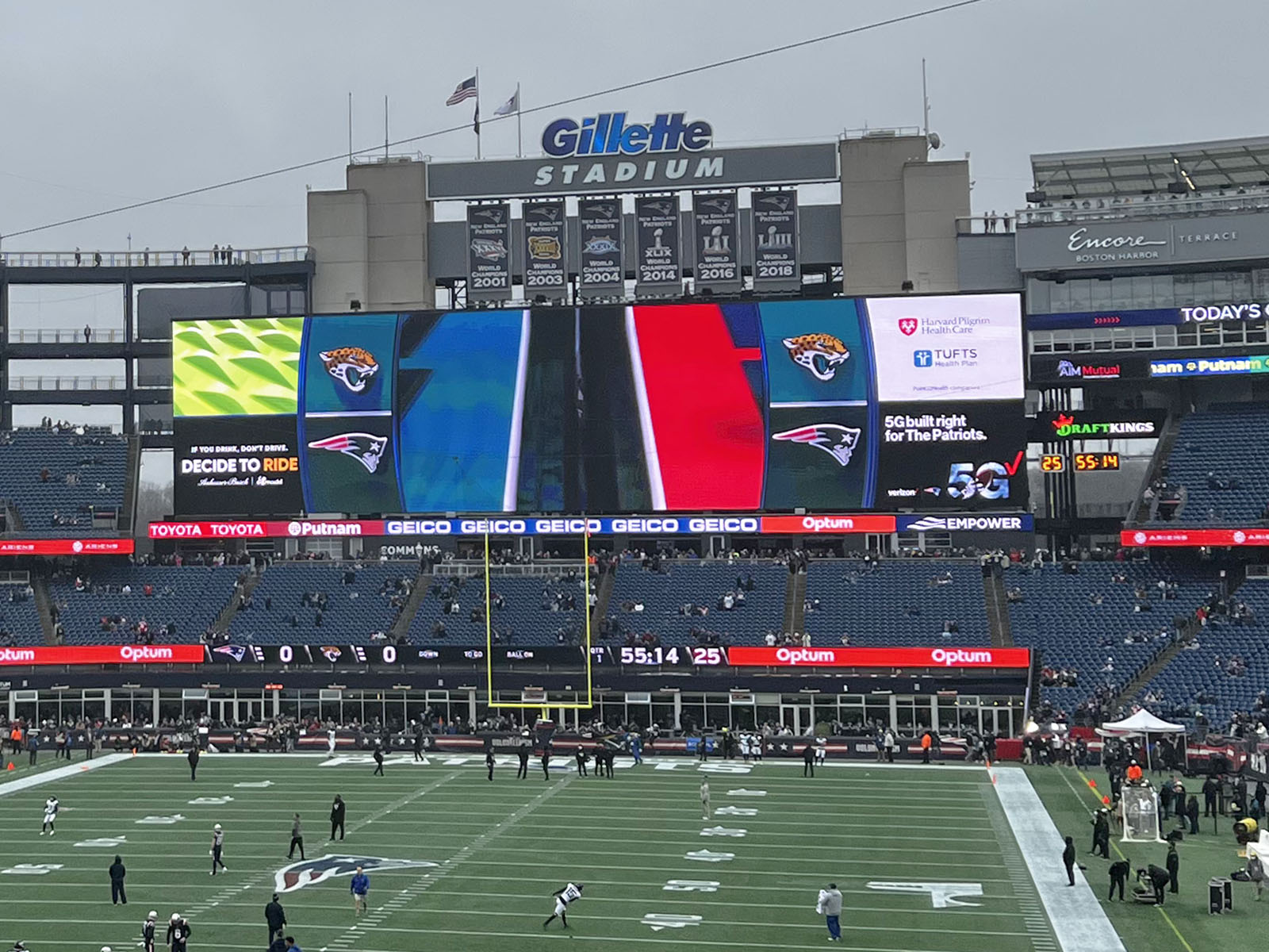 A large videoboard and the New England Patriots' championship banners hang above the end zone at Gillette Stadium in Foxborough, Massachusetts