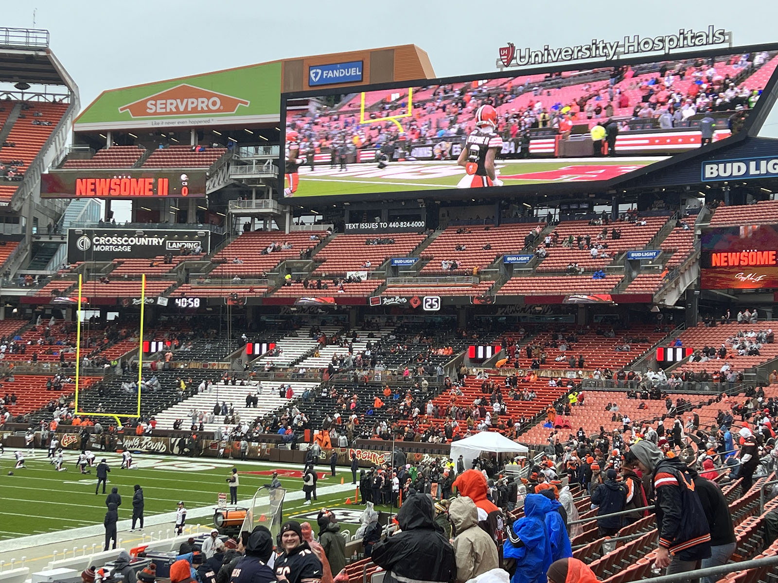 Fans watch warmups before a Browns football game from the "Dawg Pound" stands at Huntington Bank Field in Cleveland, Ohio