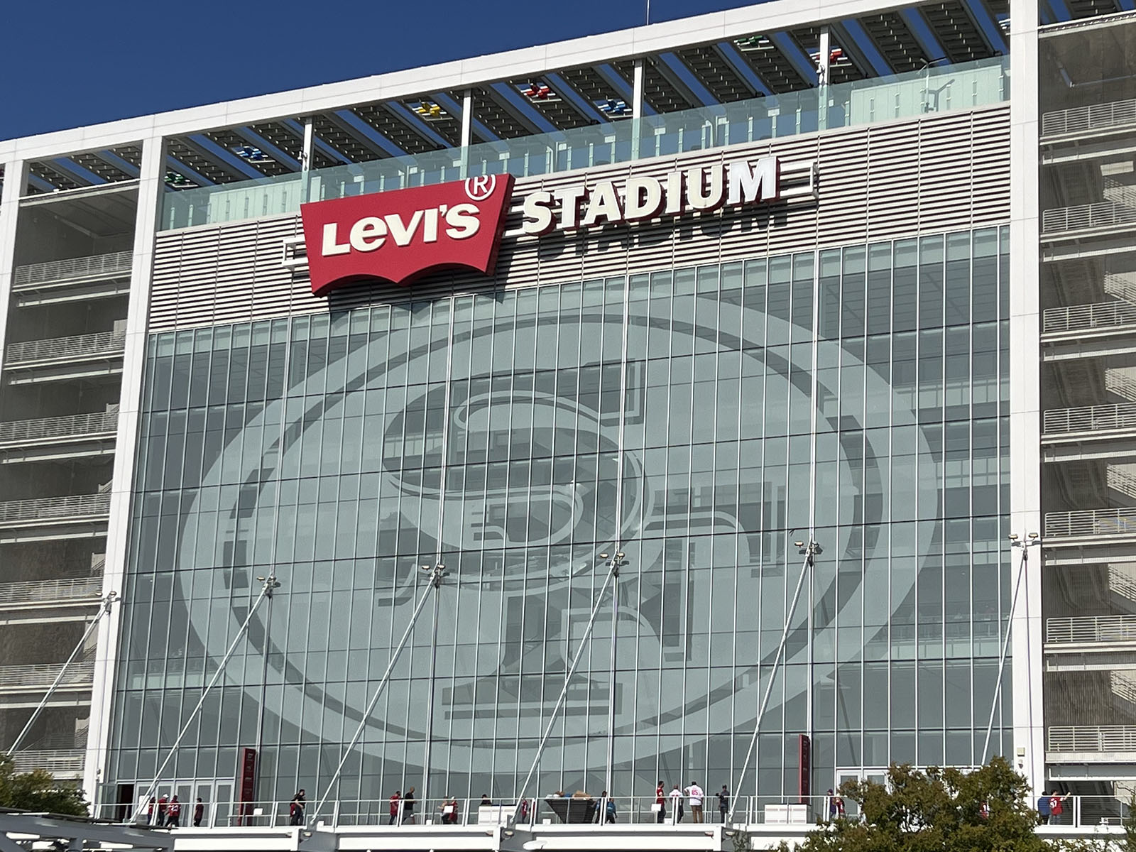 Exterior signage and the San Francisco 49ers logo displayed on the façade of Levi's Stadium in Santa Clara, California