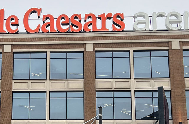 Signage posted atop the east side of Little Caesars Arena in Detroit, Michigan