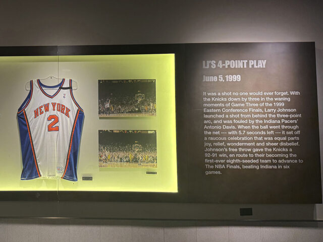 A display showing a Knicks jersey on the concourse at Madison Square Garden in New York City