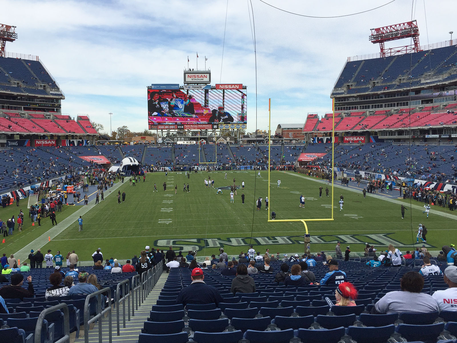Players warm up on the field before a Titans football game at Nissan Stadium in Nashville, Tennessee