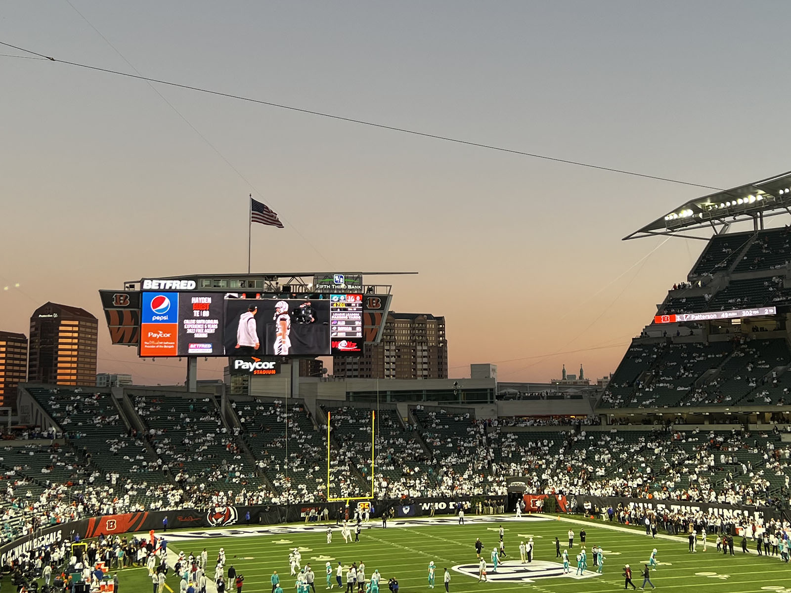 Players warm up on the field prior to a Bengals football game at Paycor Stadium in Cincinnati, Ohio