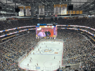 View of the rink and seating bowl from behind one of the nets at PPG Paints Arena in Pittsburgh, Pennsylvania