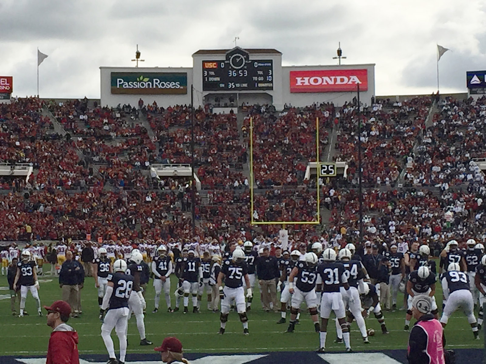 Players warm up on the field prior to the Rose Bowl Game at the Rose Bowl stadium in Pasadena, California