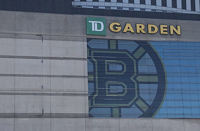 Panoramic view of the exterior of TD Garden in Boston, Massachusetts, with the Bruins and Celtics logos displayed