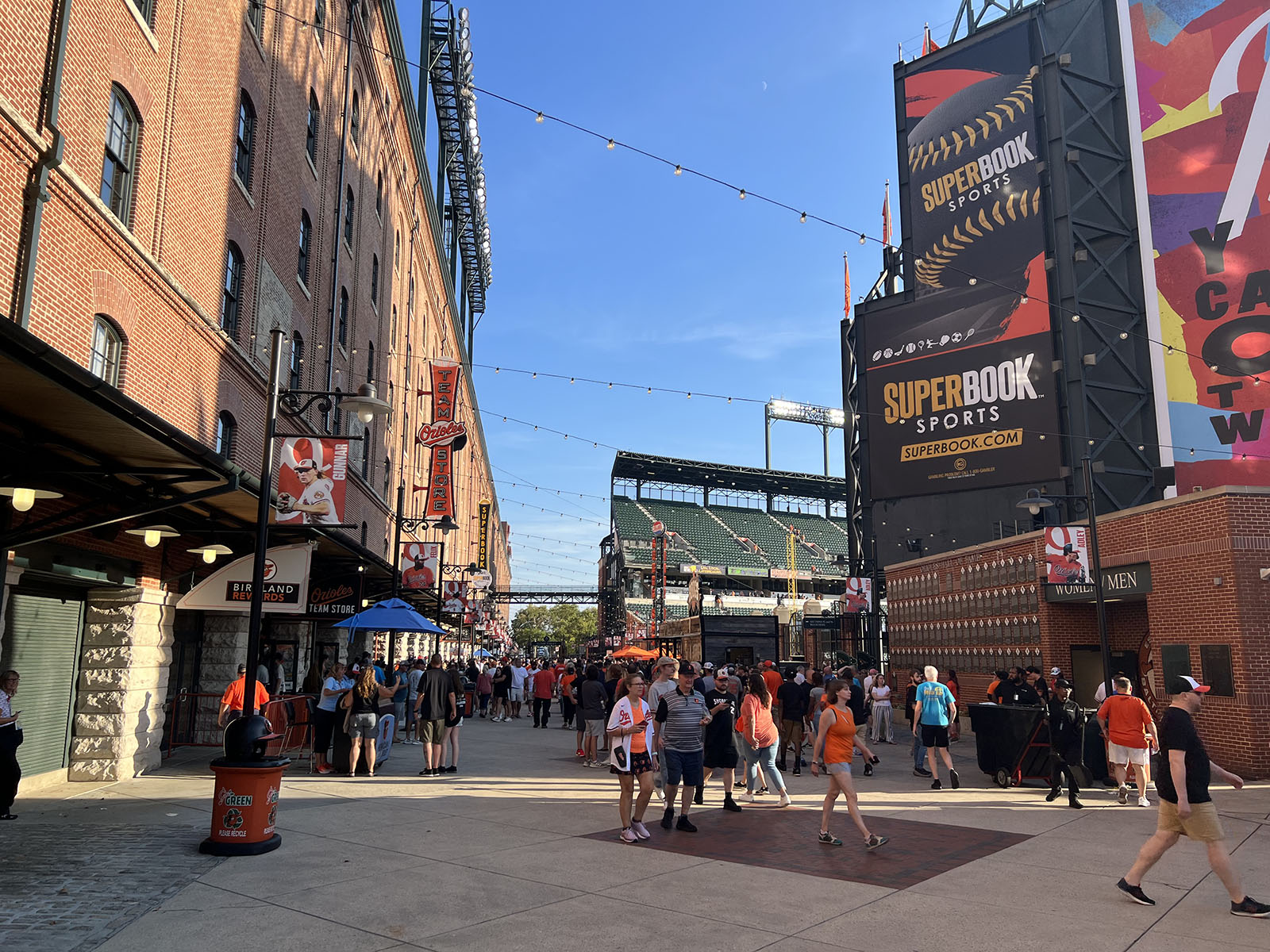 Fans walk along Eutaw Street before a Baltimore Orioles game at Oriole Park at Camden Yards