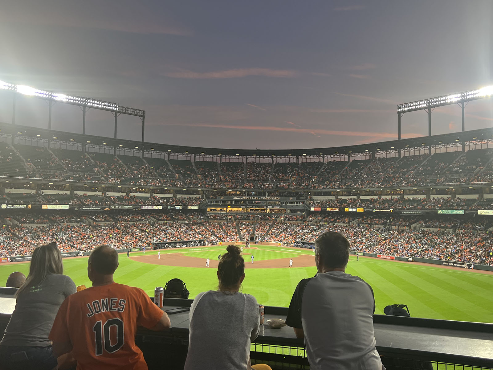 Fans watch a Baltimore Orioles game from an outfield balcony at Camden Yards