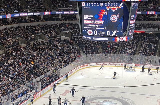 Panoramic view of the rink and seating bowl at Canada Life Centre in Winnipeg, Manitoba, Canada, during a Jets hockey game