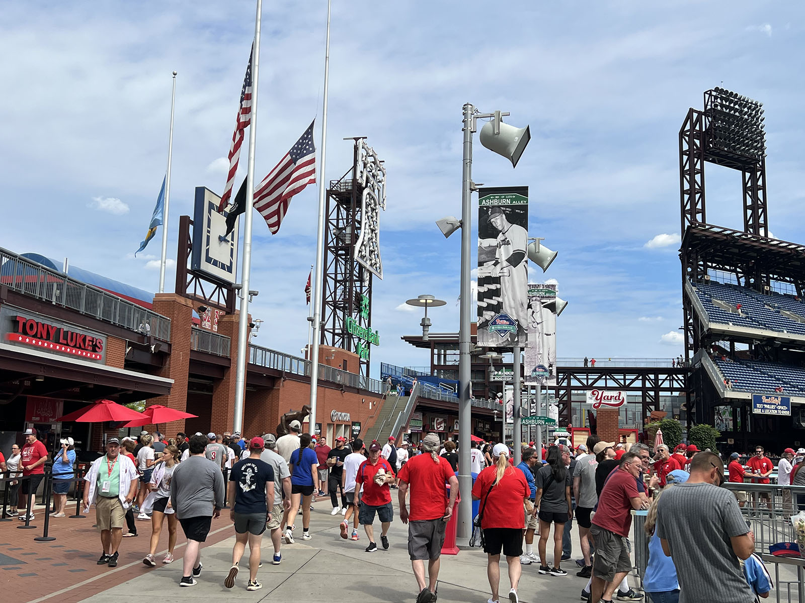 Fans walk along the outfield concourse, named Ashburn Alley, at Citizens Bank Park in Philadelphia, Pennsylvania