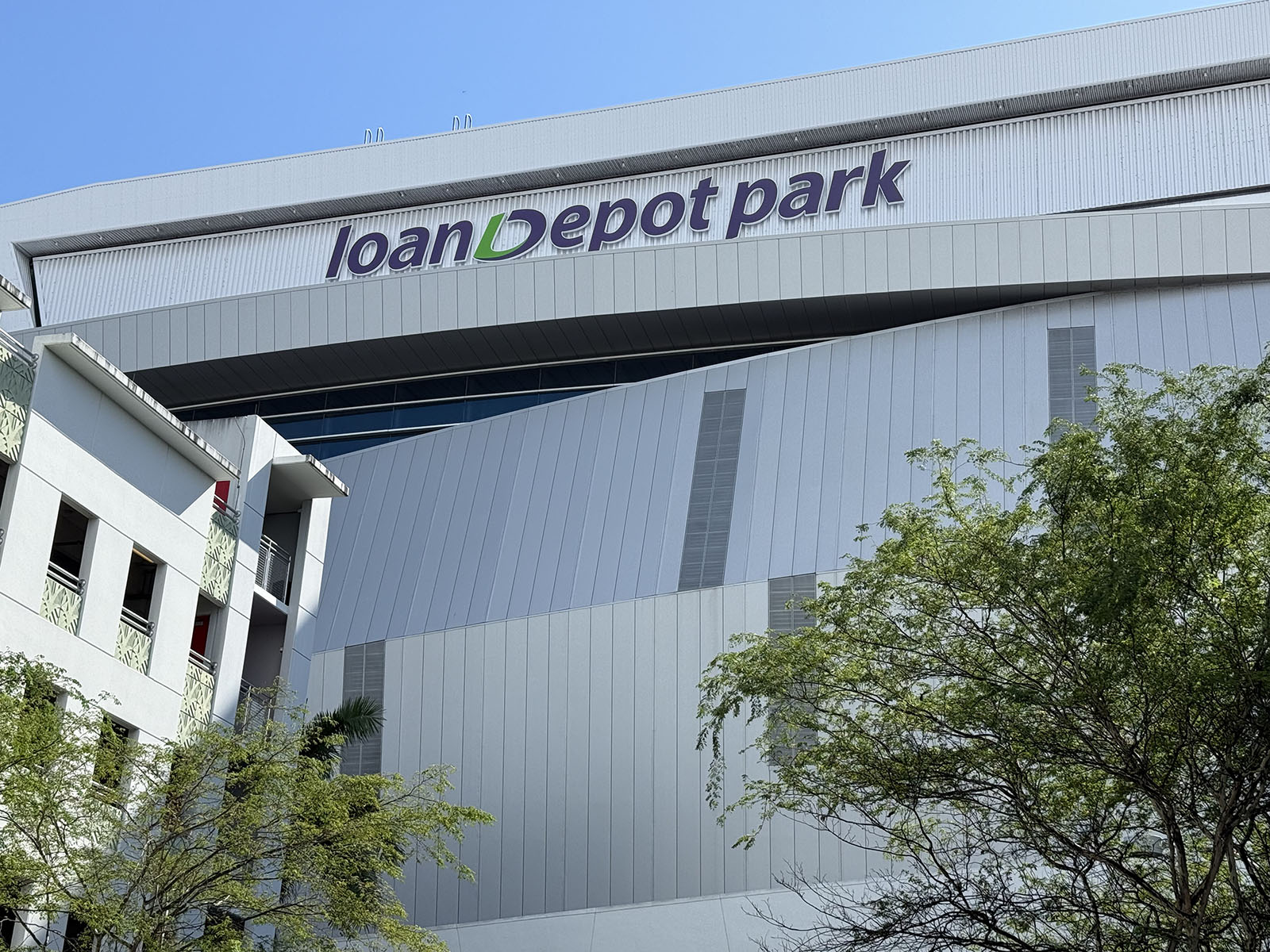Exterior signage outside LoanDepot Park, a baseball stadium in Miami, Florida