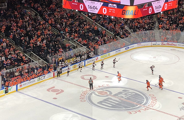 Panoramic view of the rink and seating bowl at Rogers Place in Edmonton, Alberta, during an Oilers hockey game