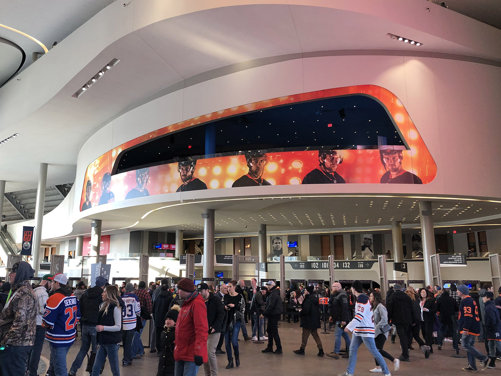 Oilers fans walk on the main concourse at Rogers Place in Edmonton, Alberta, Canada