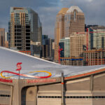 Panoramic view of the Scotiabank Saddledome in Calgary, Alberta, Canada, with the city skyline in the background