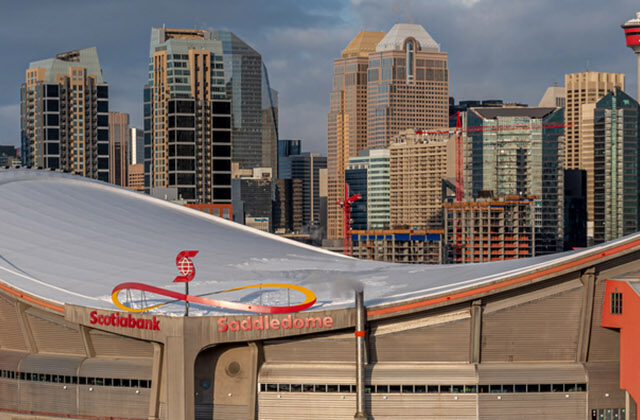 Panoramic view of the Scotiabank Saddledome in Calgary, Alberta, Canada, with the city skyline in the background