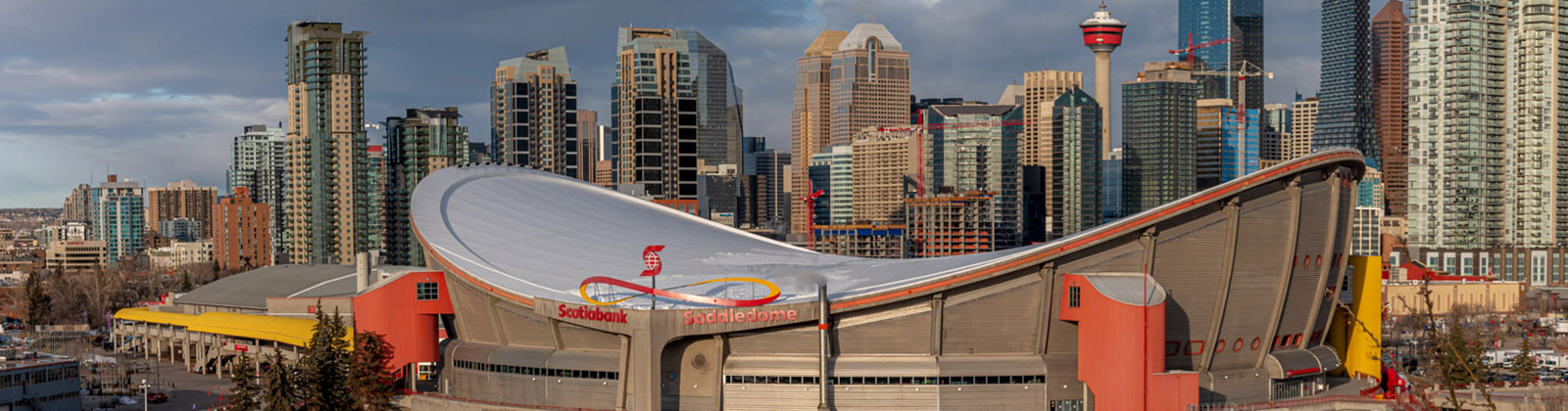 Panoramic view of the Scotiabank Saddledome in Calgary, Alberta, Canada, with the city skyline in the background