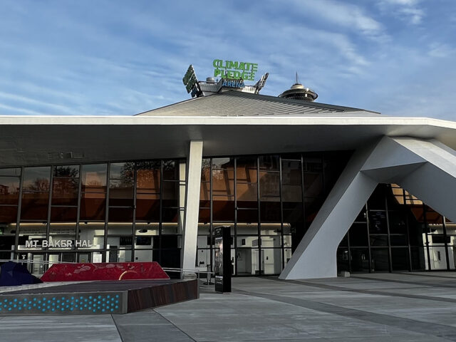 Exterior view of the façade and roof of Climate Pledge Arena in Seattle, Washington
