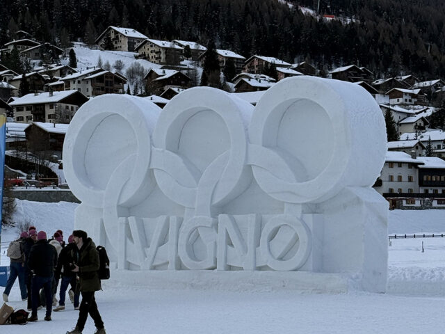 A snow sculpture features the Olympic rings in Livigno, Italy, during the 2026 Winter Games