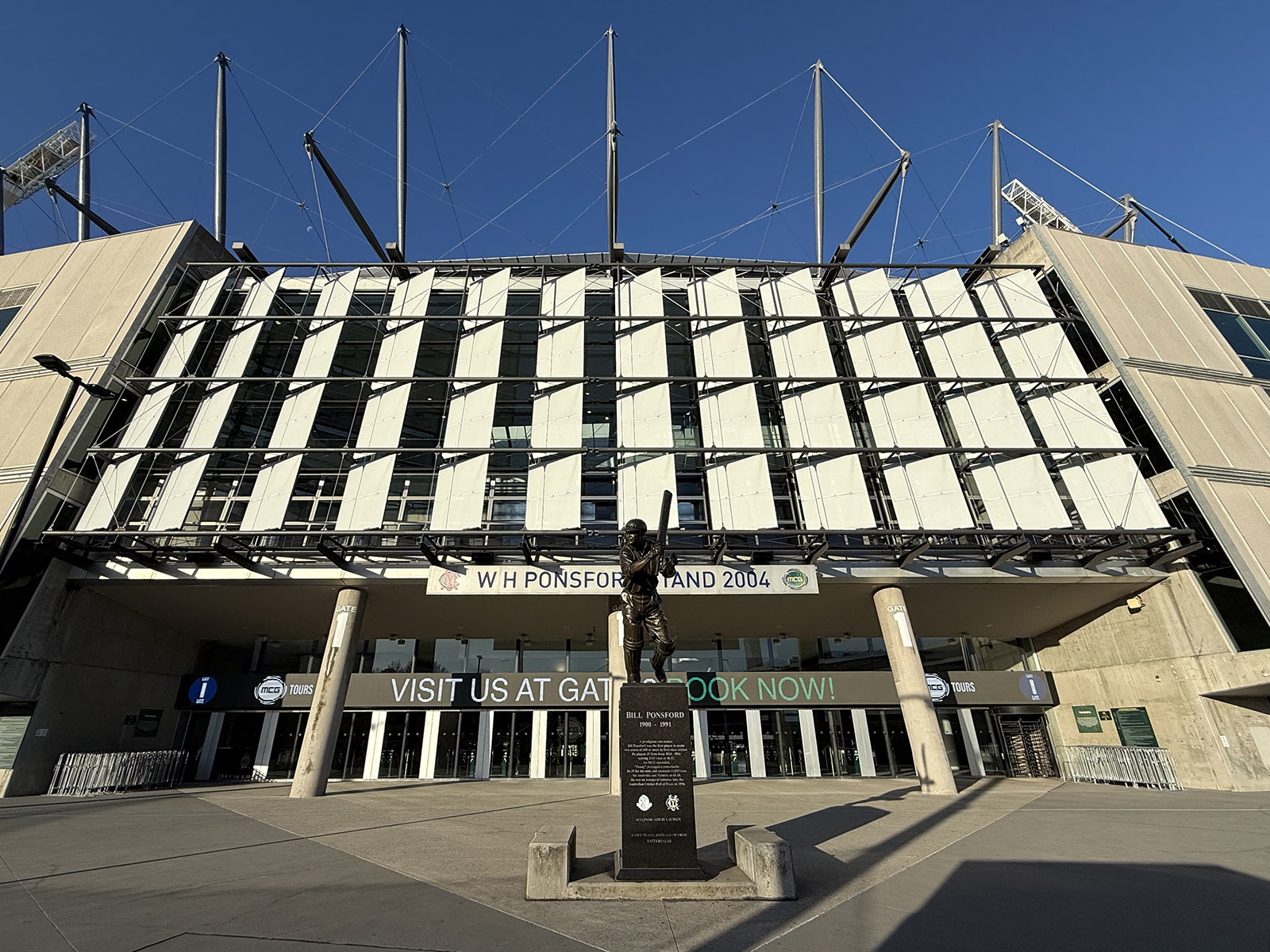 A statue of W.H. Ponsford stands in front of the entrance to the Ponsford stand at the Melbourne Cricket Ground