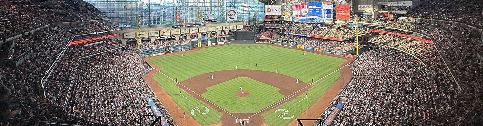 Panoramic view of the seating bowl at Daikin Park in Houston, Texas, during an Astros baseball game