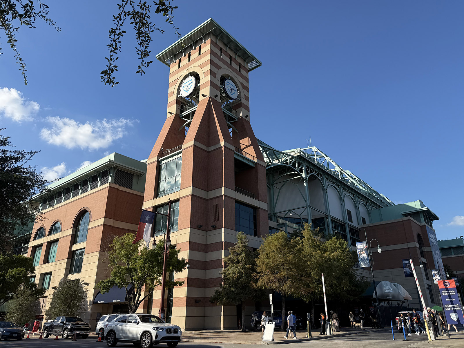 A clock tower stands next to the home plate gate at Daikin Park in Houston, Texas