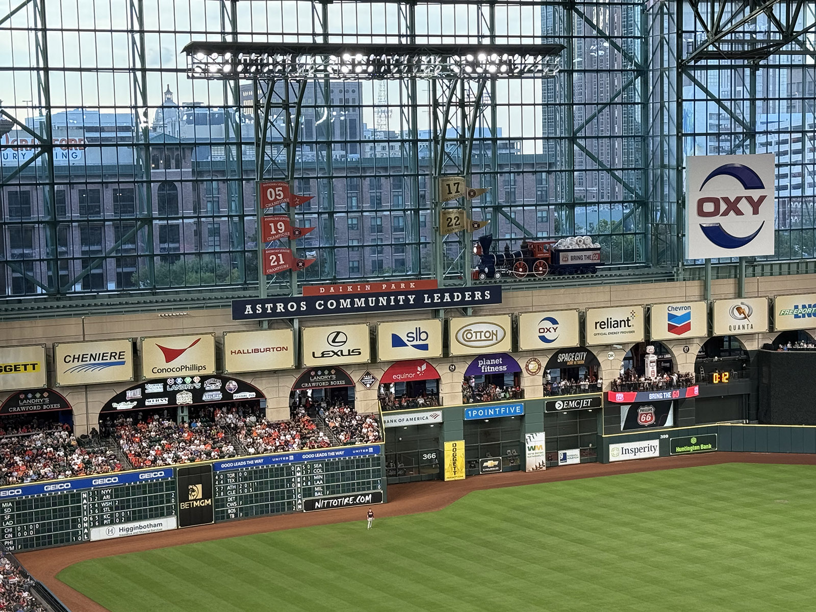 The Crawford Boxes and a track featuring a locomotive filled with baseballs adorn left field at Daikin Park in Houston, Texas