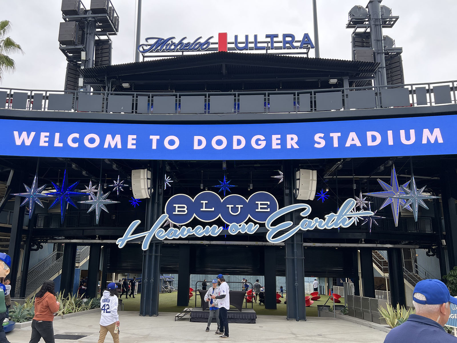 A sign reading "Blue Heaven on Earth" adorns the outfield plaza at Dodger Stadium in Los Angeles