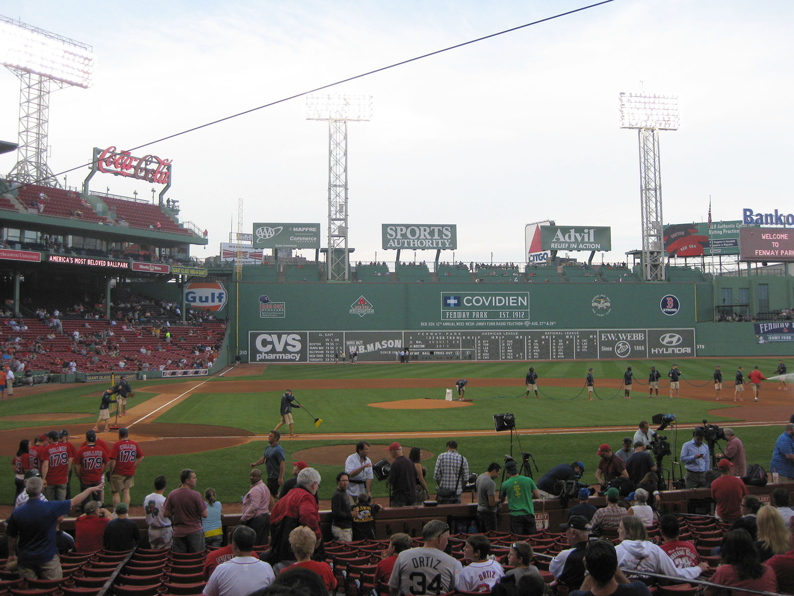 Groundskeepers prepare the field prior to a Red Sox baseball game at Fenway Park in Boston, Massachusetts
