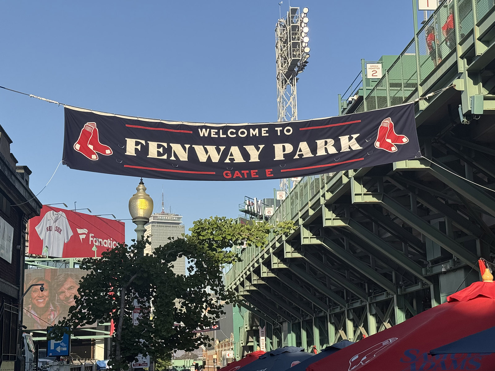 A banner hangs outside the alley behind left field at Fenway Park in Boston, Massachusetts