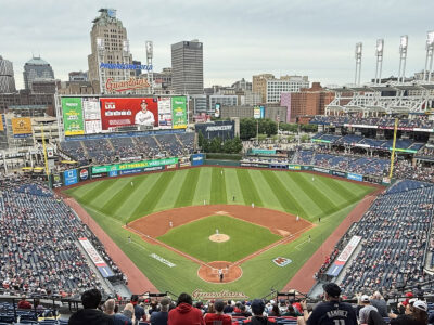 View of the field from behind home plate at Progressive Field in Cleveland, Ohio, during a Guardians baseball game