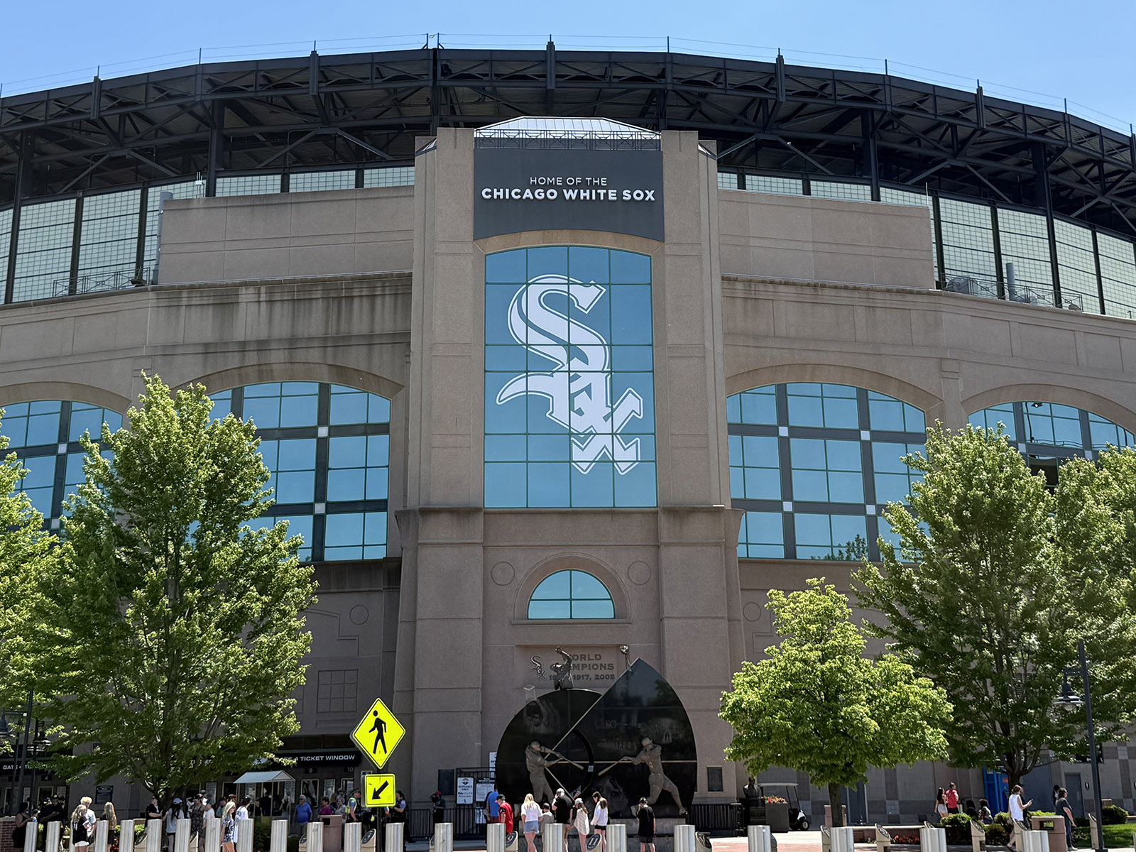 The White Sox logo is displayed on the façade of Rate Field, a baseball stadium in Chicago, Illinois