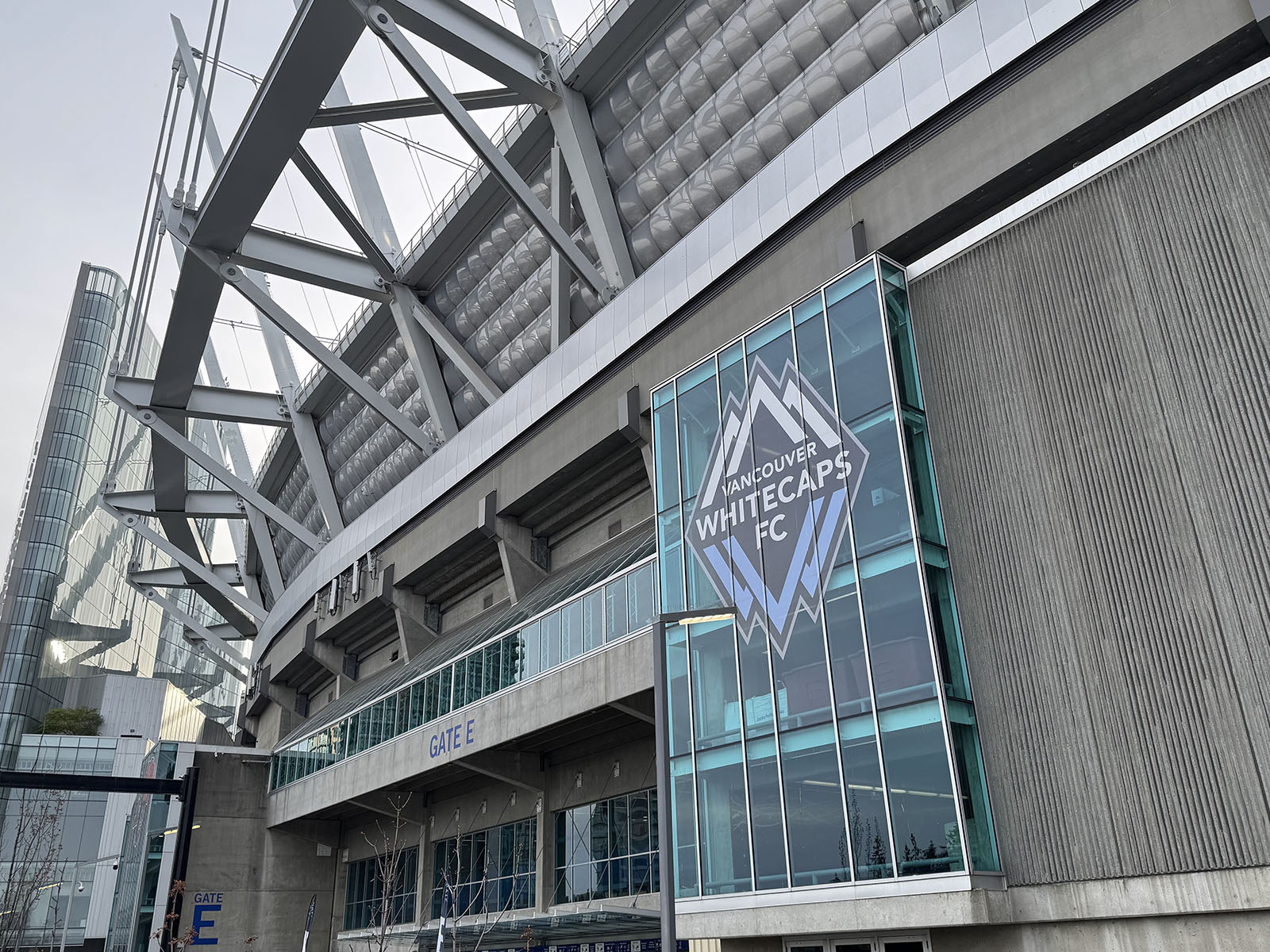 The Vancouver Whitecaps logo shown on an exterior window of BC Place stadium in Vancouver, British Columbia