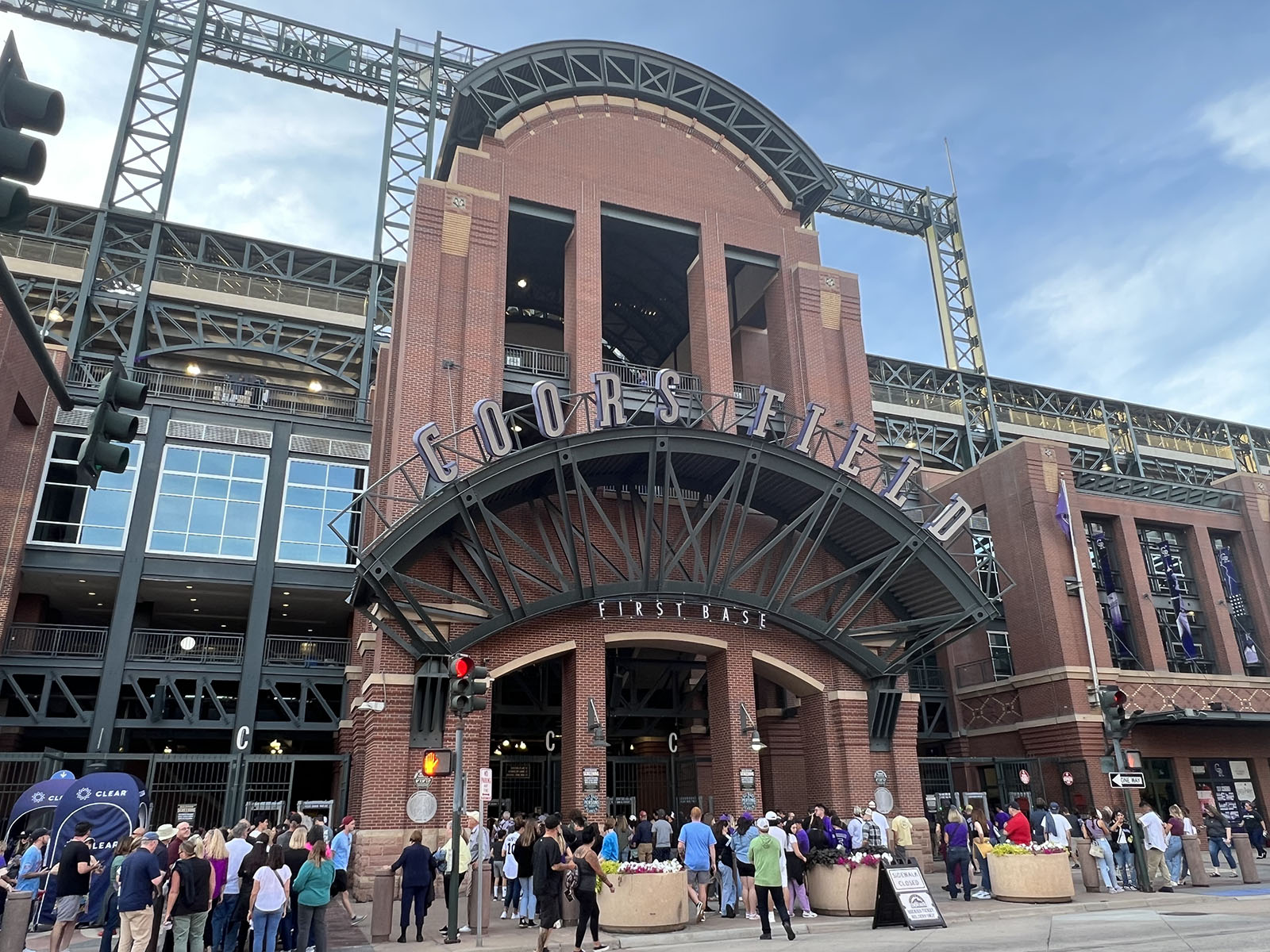 Baseball fans wait to enter Coors Field in Denver before a Colorado Rockies game