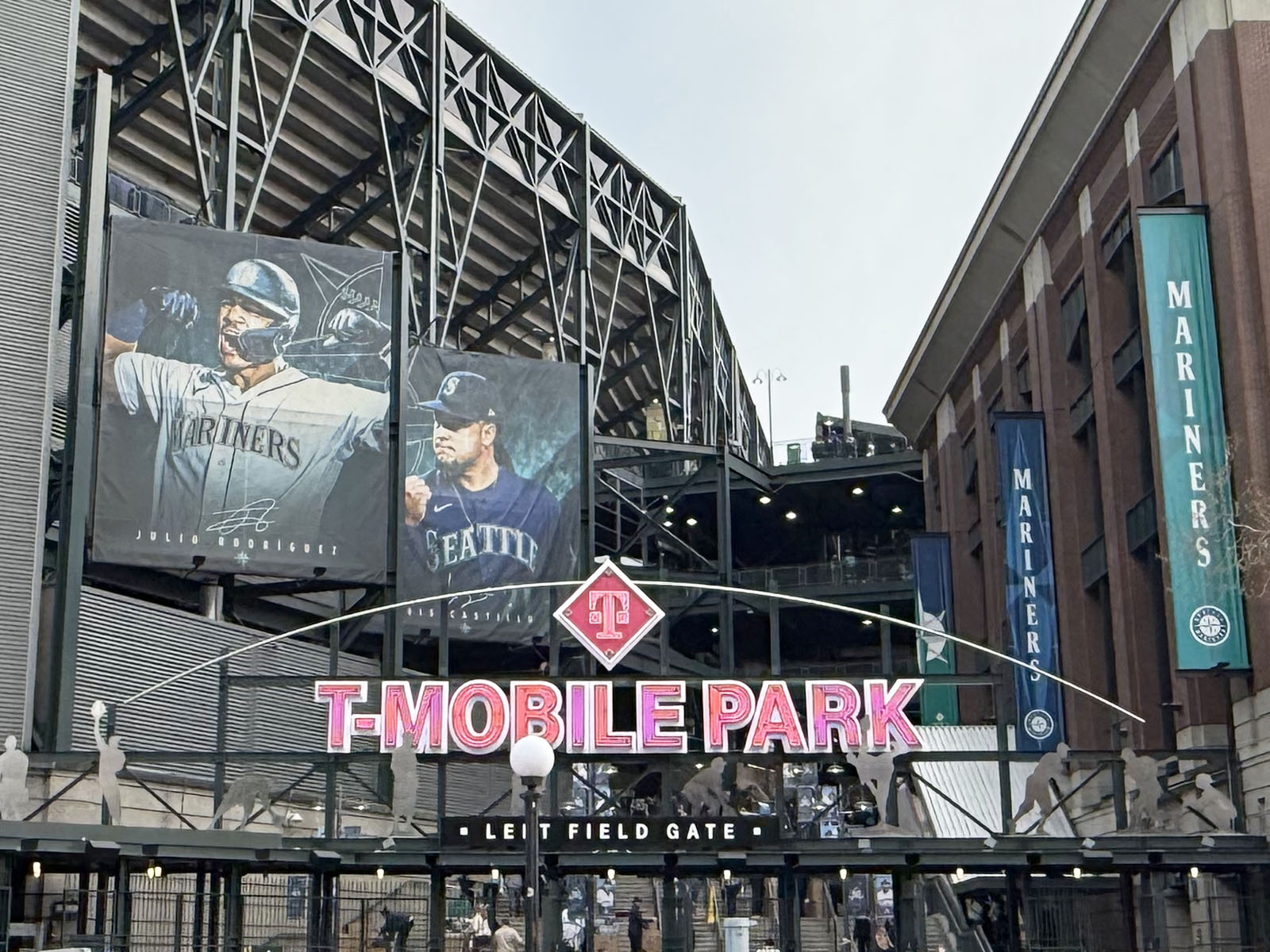 Signage above the left-field gate shows the logo of T-Mobile Park, a stadium in Seattle, Washington