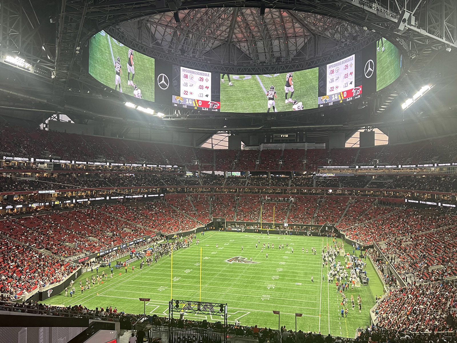 View of the field and seating bowl from behind one of the end zones at Mercedes-Benz Stadium in Atlanta, Georgia