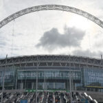A distinctive arch stands above the structure of Wembley Stadium in London, England