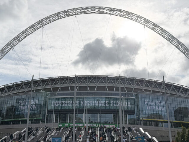 A distinctive arch stands above the structure of Wembley Stadium in London, England