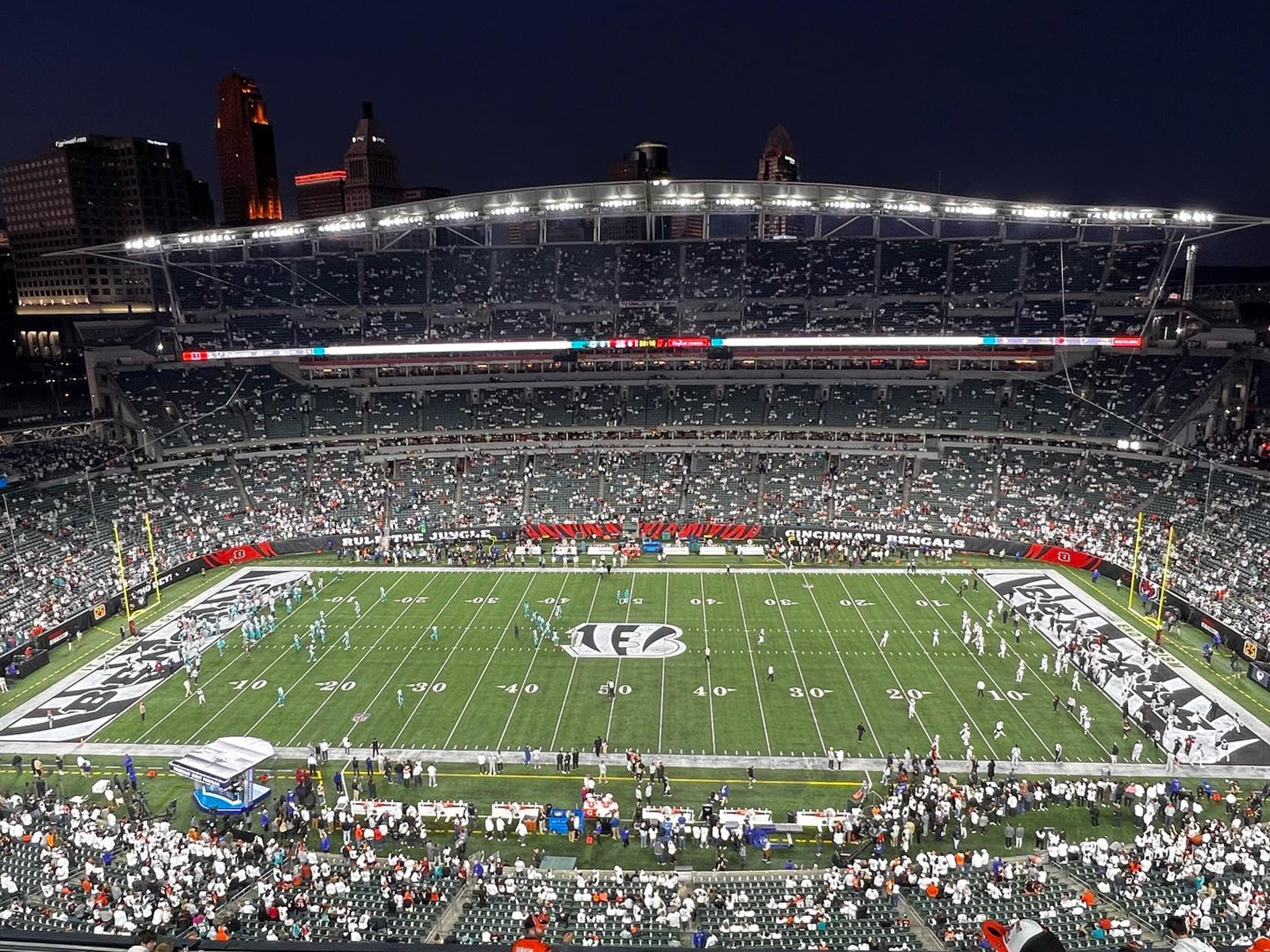 Players warm up on the field prior to a Bengals football game at Paycor Stadium in Cincinnati, Ohio