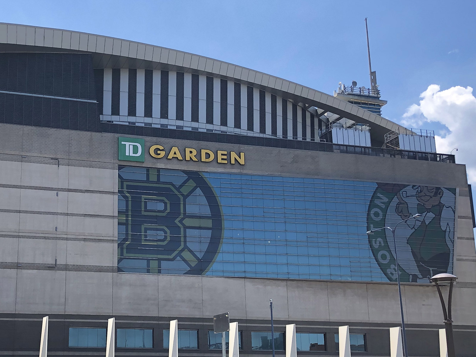 Exterior view of TD Garden in Boston, Massachusetts, with the Bruins and Celtics logos prominently displayed